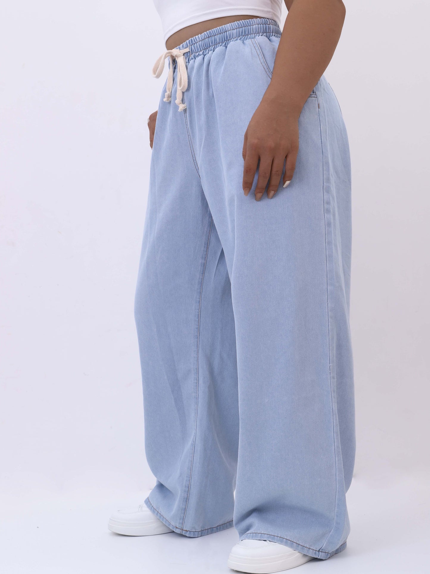 Women's plus size wide-leg jeans with high rise, drawstring waist, solid color denim for spring/fall.