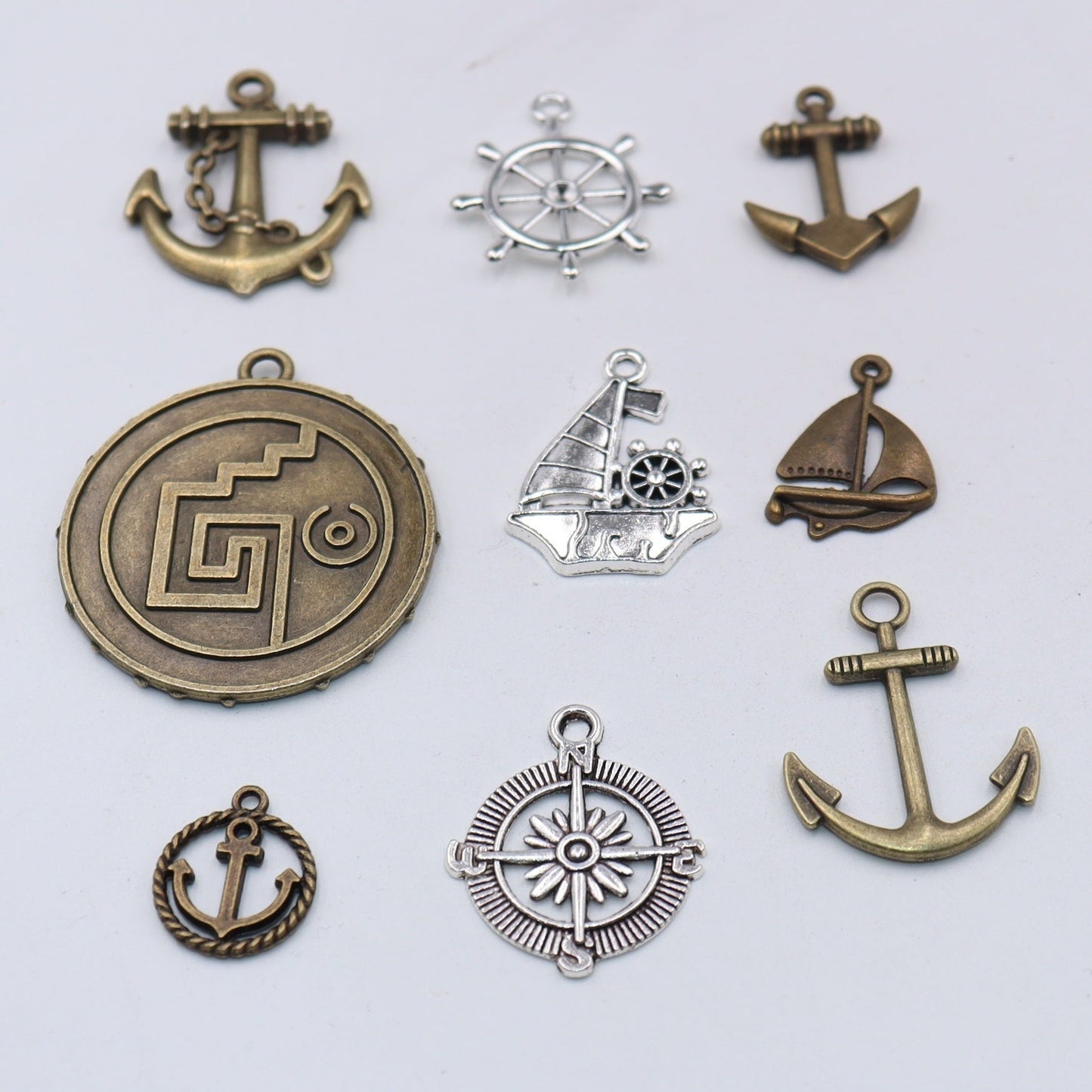 Set of 30 Assorted Pirate-themed DIY Jewelry Pendants, featuring Retro Alloy Anchor, Rudder, Compass, and Ship Wheel designs, perfect for creating Nautical Style Jewelry