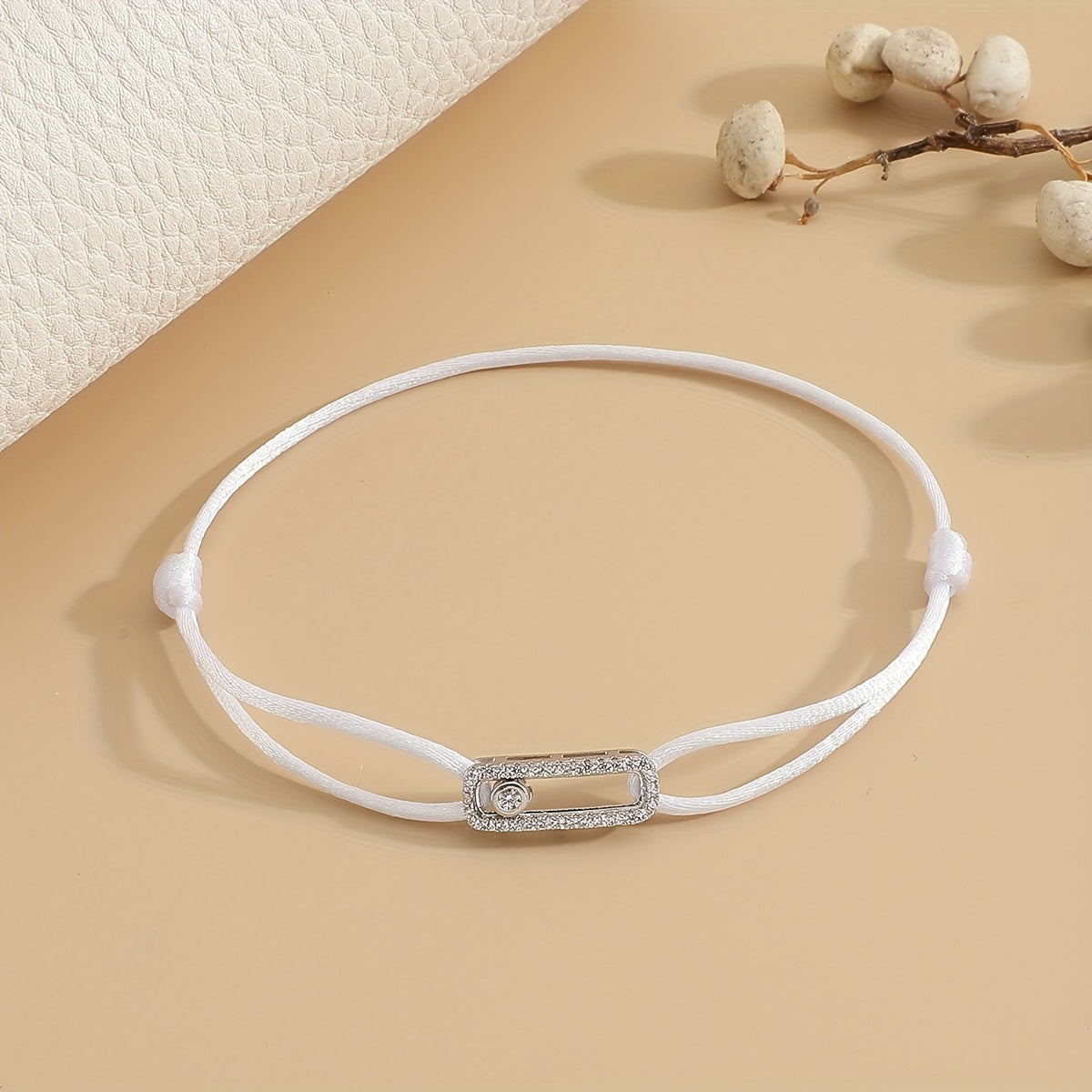 A stylish and timeless charm bracelet designed for women, featuring adjustable sizing and movable zirconia accents. This premium accessory is the perfect gift for any fashionable woman who appreciates high-quality jewelry.