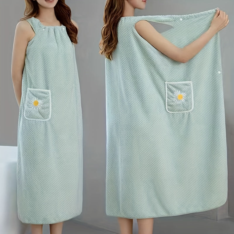 Extra-long light blue coral fleece bath towel with daisy pocket. Highly absorbent, machine washable, soft, and durable. Perfect for bathroom or robe wear.