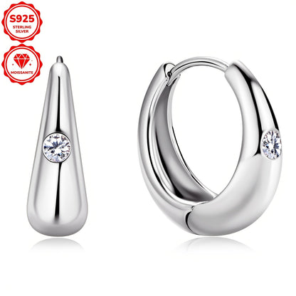 These stylish women's hoop earrings are crafted from 925 sterling silver and adorned with 2.5mm Mozambique stones. The simple yet fashionable design features a circular shape, weighing a total of 4.36g in silvery color. Each earring is embellished with 2