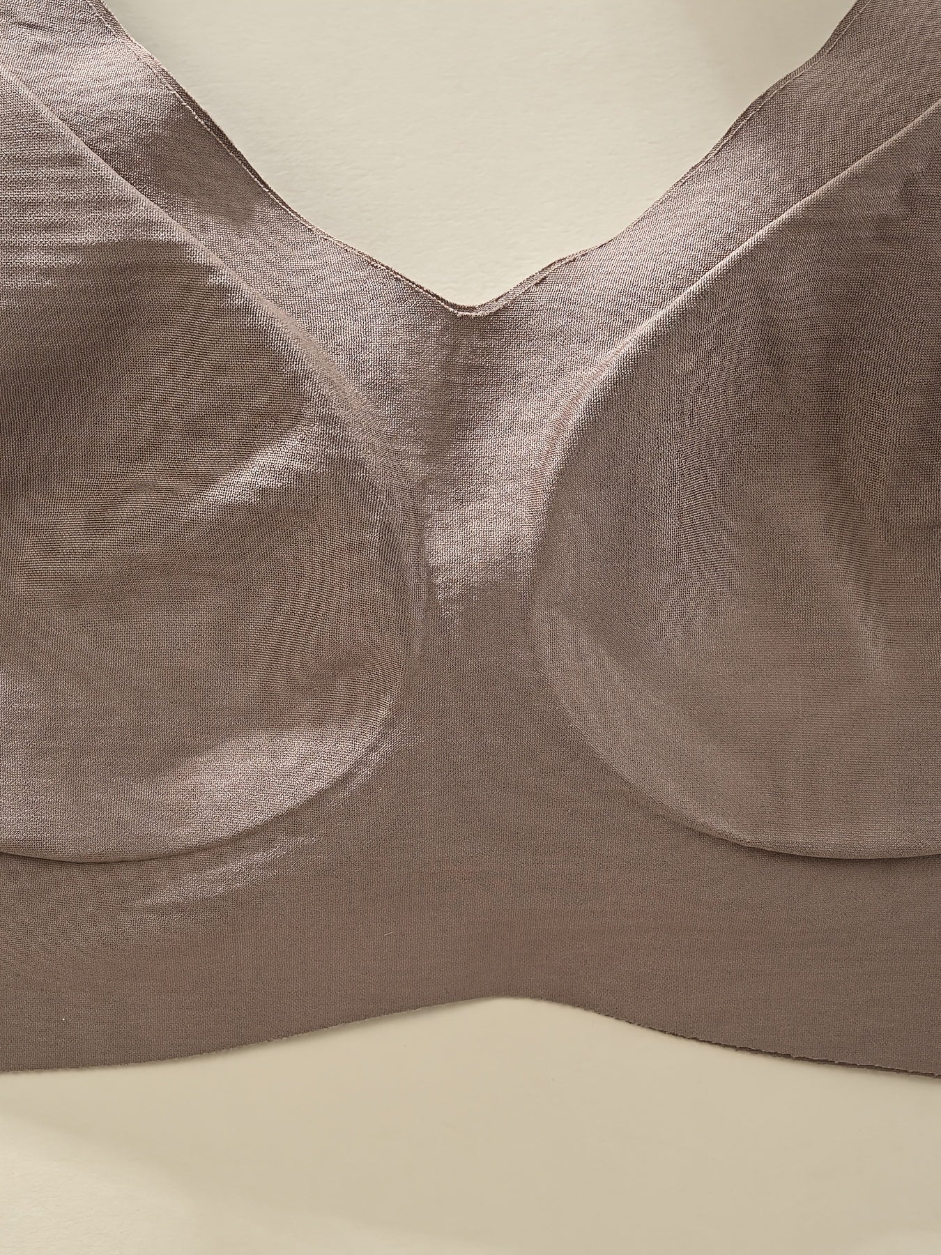 Elegant seamless wireless bralette with soft support and wide straps for comfortable daily wear.