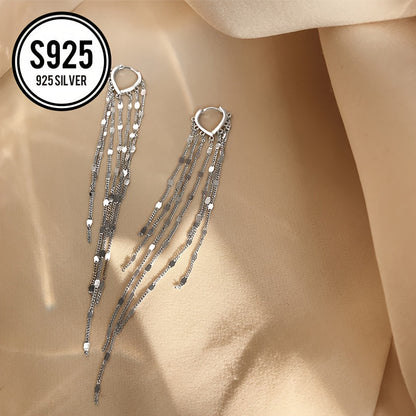 This lightweight and elegant heart tassel ear thread is made of hypoallergenic 925 silver, giving it a shiny and luxurious appearance. The long tassel design helps to slim the face and adds a touch of simplicity and fashion to any outfit. It is a perfect