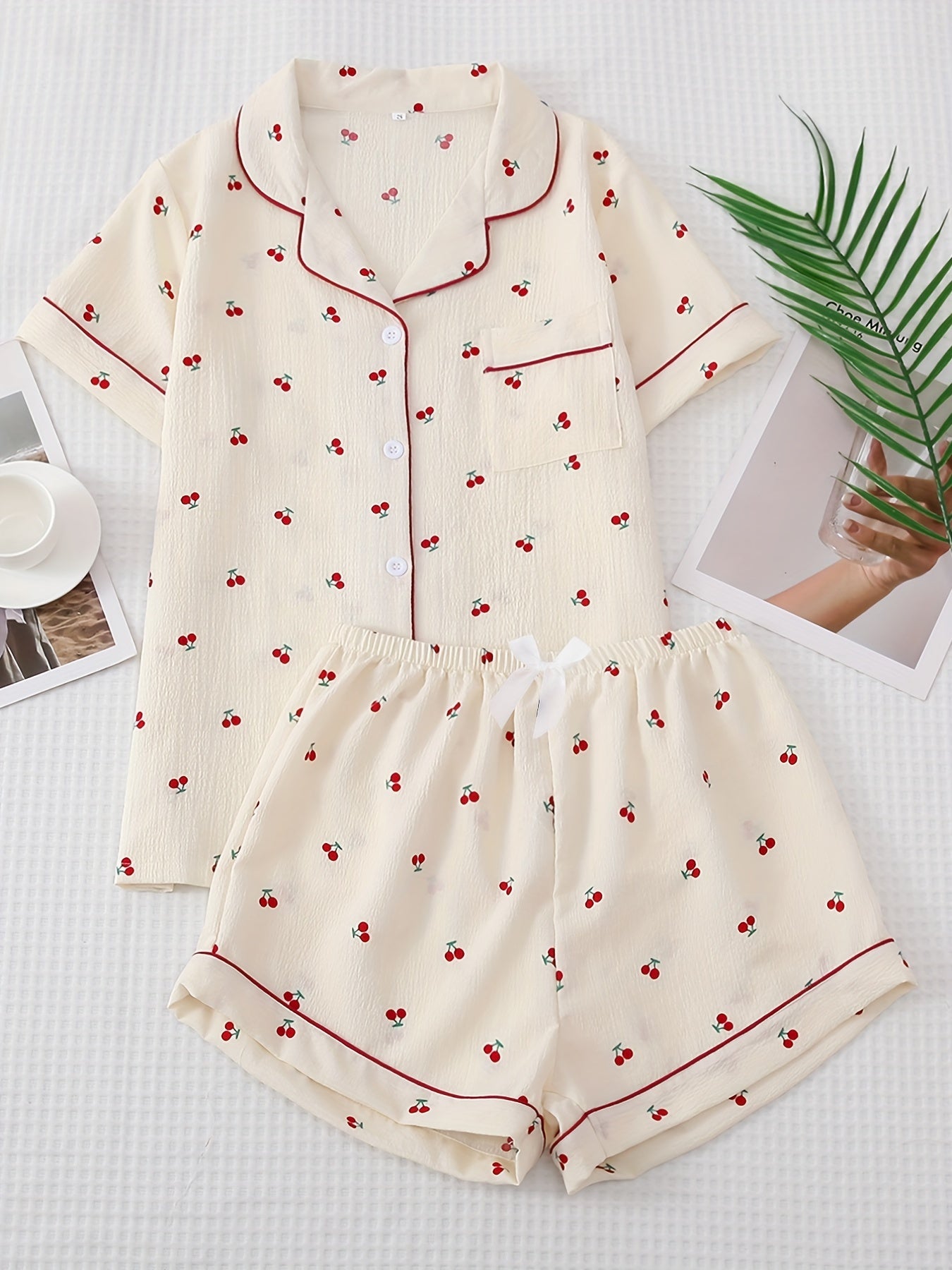 Cherry print pajama set featuring lapel button top and bow shorts, perfect for women's sleepwear and loungewear.