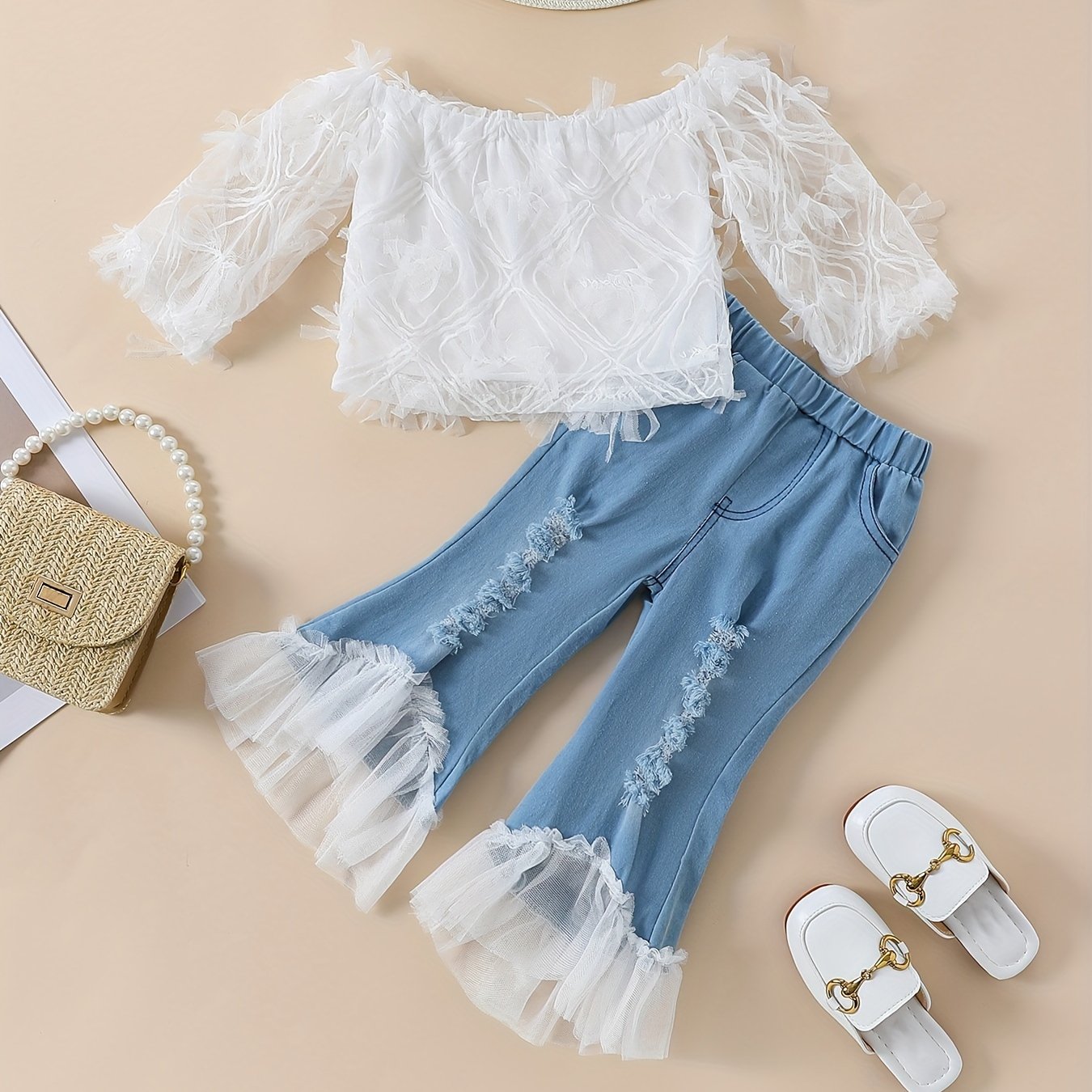 Stylish girls' summer outfit: off-shoulder white lace top with blue tulle flared pants set. Made of 100% polyester, machine washable. Perfect for outdoor wear.