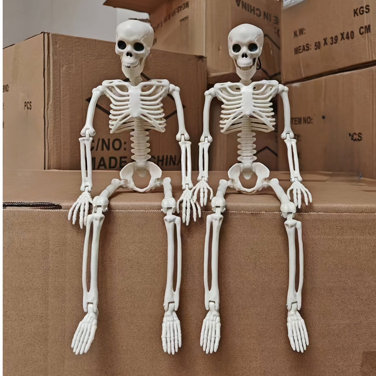 2 Halloween skeleton decorations with posable joints for creepy outdoor decor.