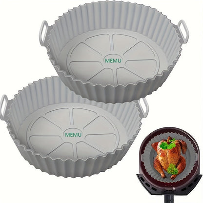 A pair of round silicone air fryer mats that are reusable, dishwasher safe, and can also be used as baking trays. These versatile mats are a must-have kitchen accessory for any home chef.