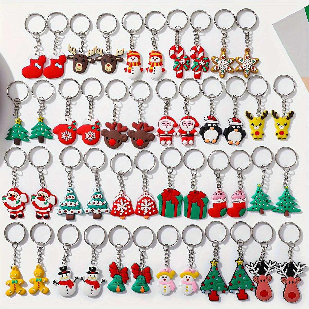 Christmas Keychain Set with 46 Pieces, featuring Santa, Snowman, Christmas Tree, and other Cartoon Characters. Made of PVC, Round Shape with Ring Buckle. Festive Decor for Car Keys and Gifts.