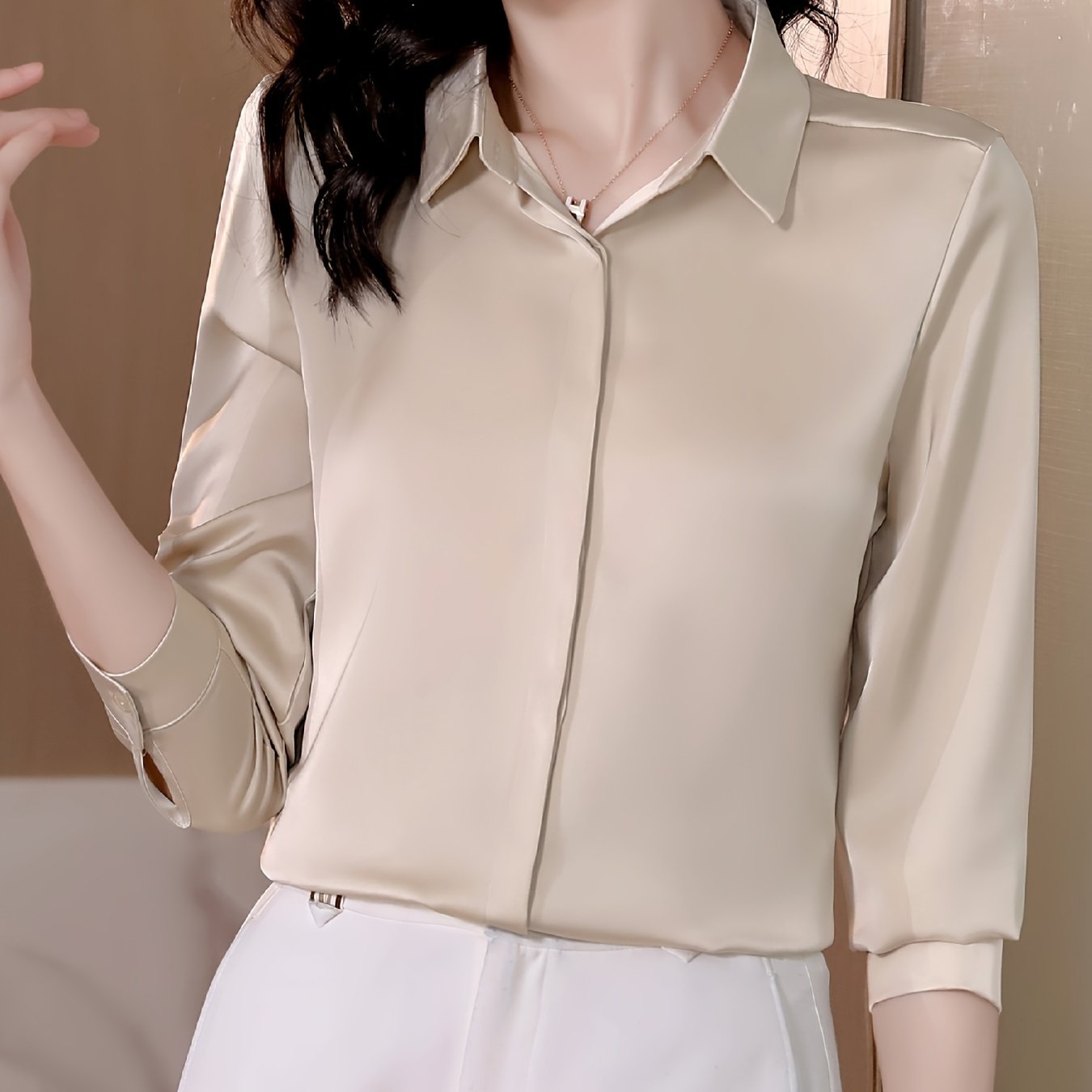 Long sleeve satin shirt with solid color, collared button-up design for women. Machine washable and perfect for spring/fall. Ideal for sophisticated adults with luxurious style.