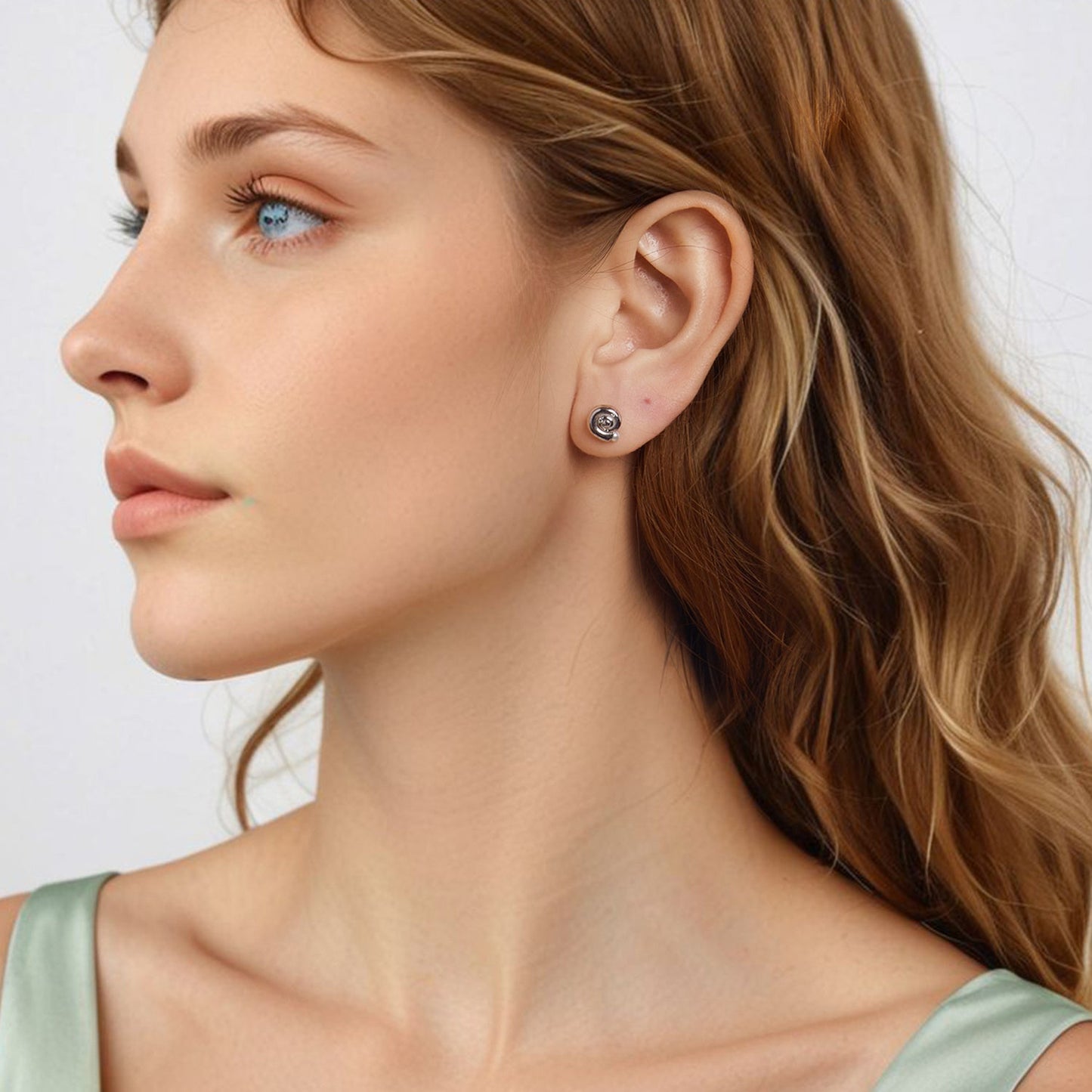 Add a touch of elegance to your look with these stunning seashell stud earrings for women. Crafted from hypoallergenic 925 silver with faux pearl inlay, these earrings are perfect for daily wear or as a thoughtful gift. Weighing 3.4g, these