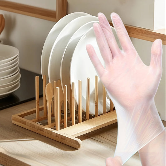 100 pieces of versatile disposable gloves made from thick, transparent TPE material ideal for use in the kitchen, baking, cleaning, and more. These gloves are lead-free and waterproof, making them essential for household tasks.