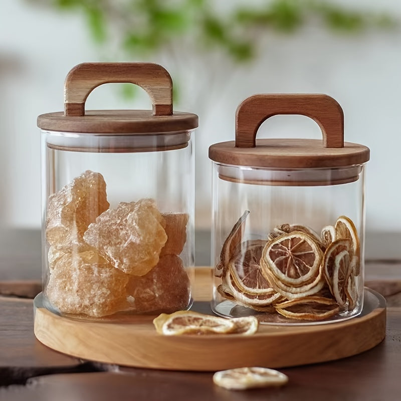 Glass storage jar with a wooden lid and a capacity of 27oz/800mL. This multi-purpose jar is freezer safe and should be hand washed only. Perfect for storing coffee, tea, or food.