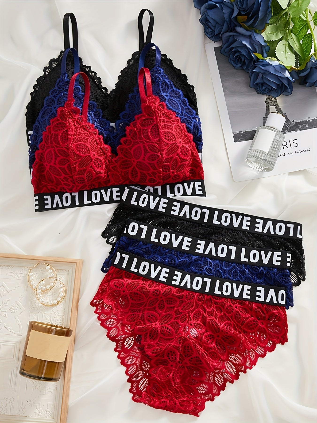 Three sets of lingerie with colorblock letter tape design, floral lace detail, and matching bra and panties for women.