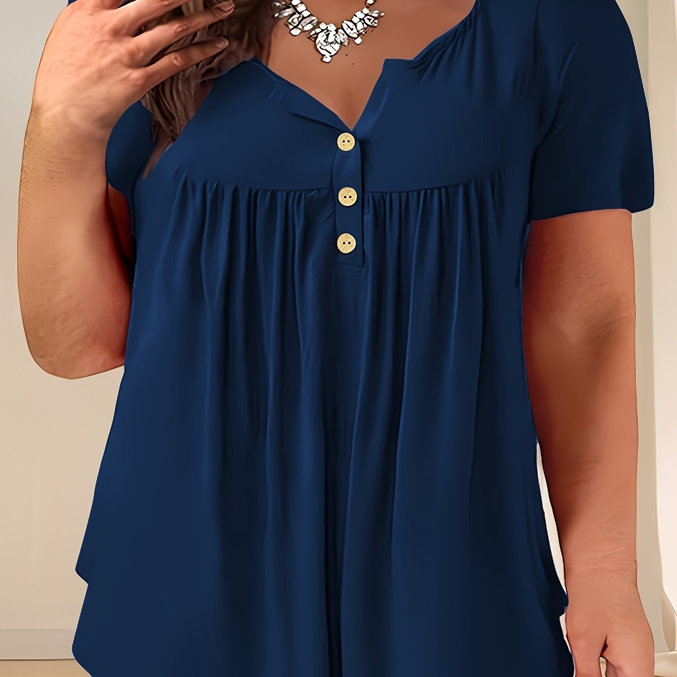 Women's plus size casual pleated t-shirt in navy blue, made with summer knit fabric, crew neck, solid color, and slight stretch. Oversized pullover style, 95% polyester and 5% spandex.