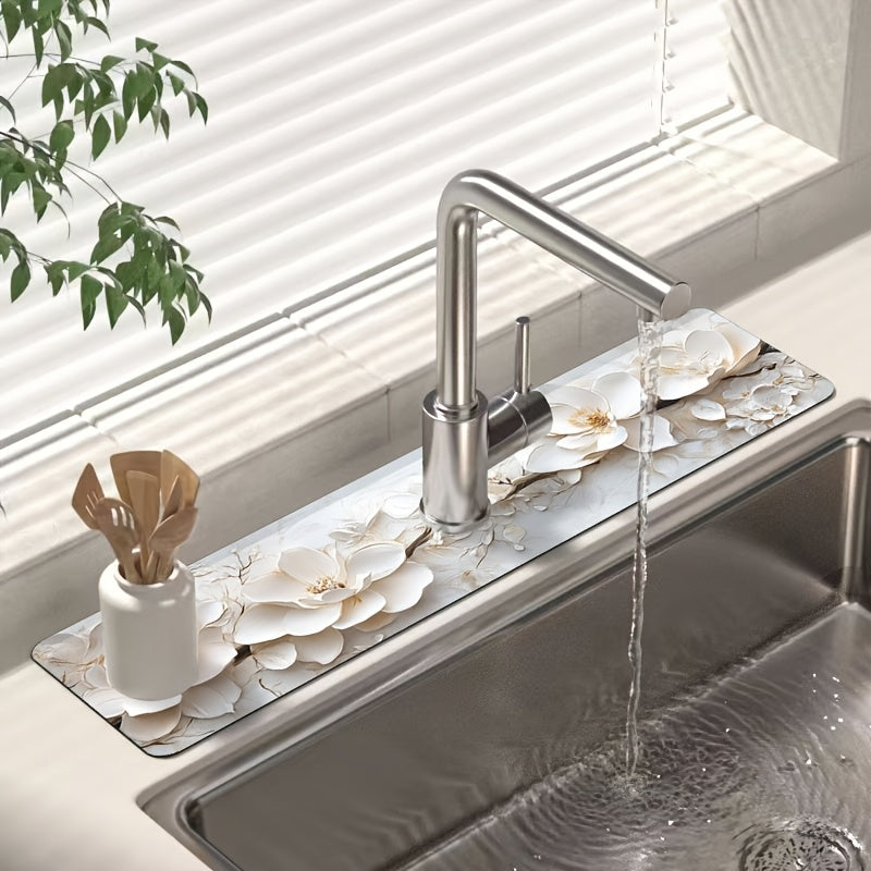 Add a touch of elegance to your kitchen or bathroom with this 3D floral faucet mat in white. Made of durable and moisture-proof polyester, it is splash absorbent and features a suction cup for easy installation. Perfect for adding some style to your