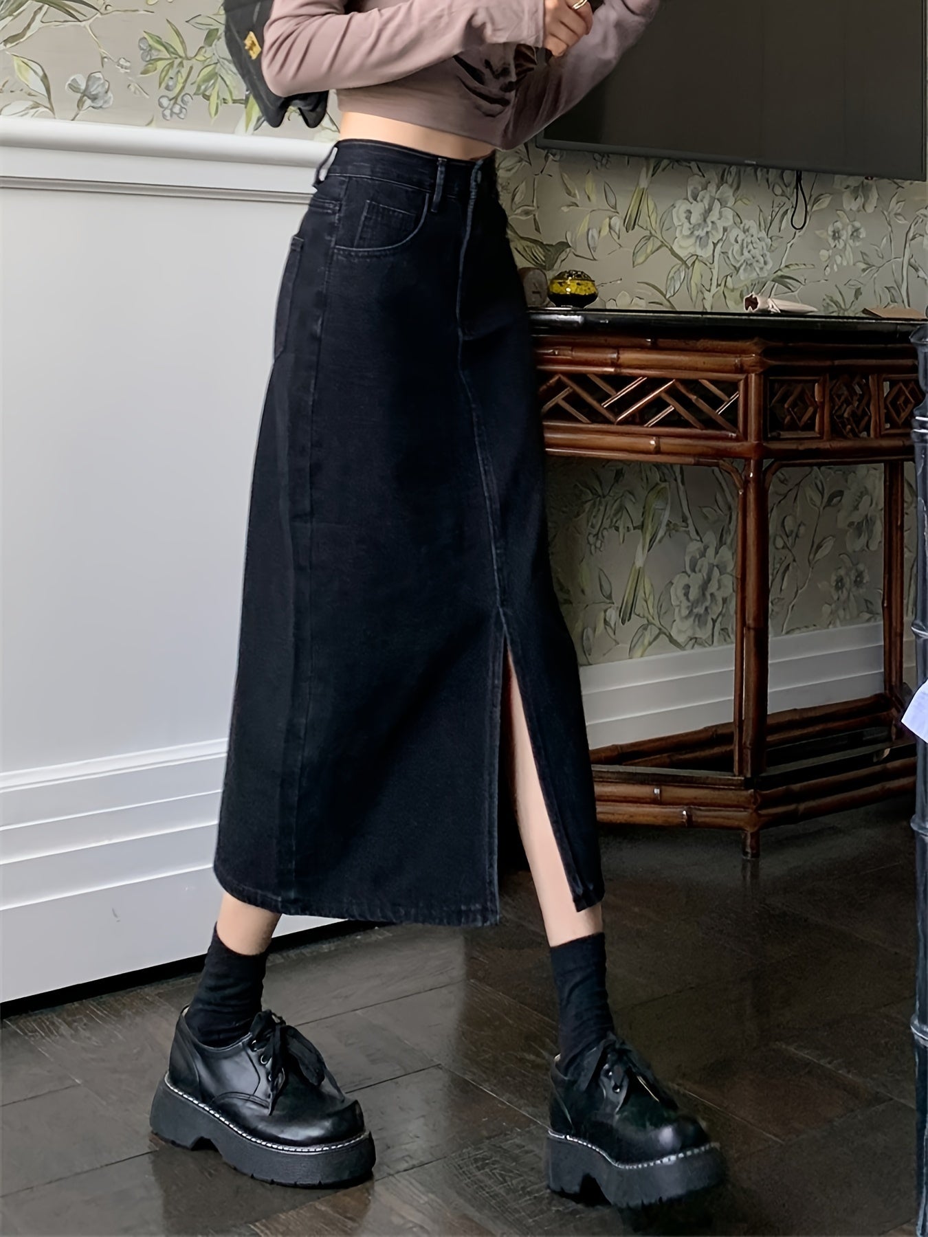 Stylish black denim midi skirt with front slit - machine washable, great for summer.