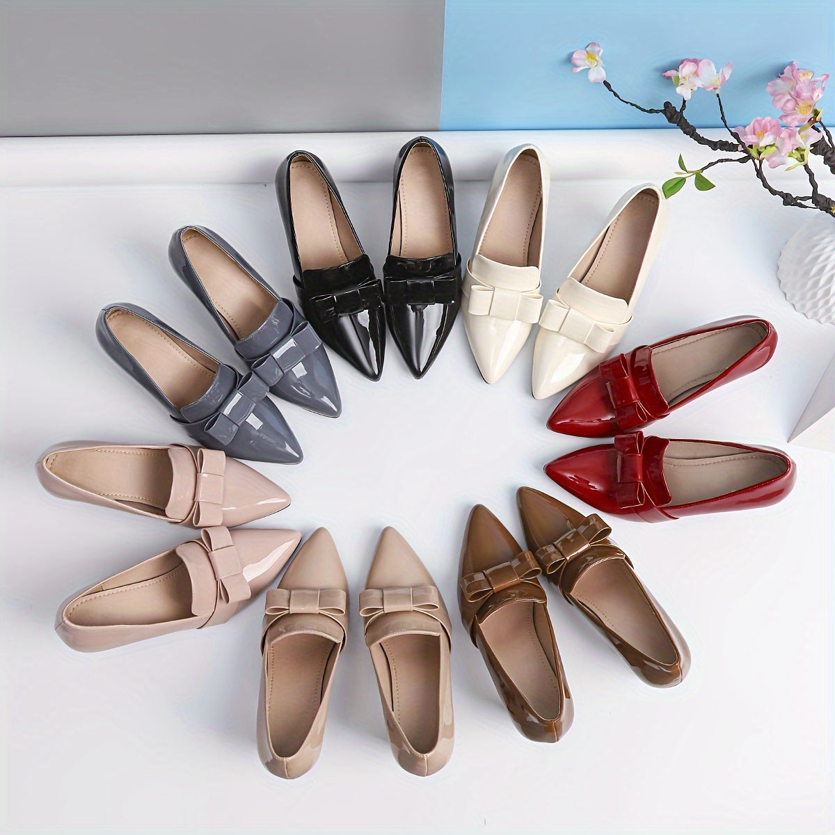 Women's elegant solid color pumps with bowknot design, block heel and waterproof features.