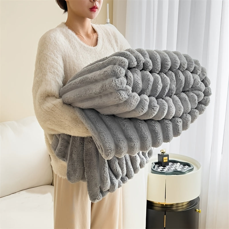 Indulge in the comfort of our luxurious plush blanket - a cozy fleece throw that will keep you warm and snuggled up on the sofa. This soft and insulating blanket is not only perfect for lounging, but also machine washable for easy care. Its modern style