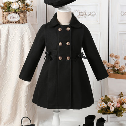 Youthful girls can look stylish in this casual polyester trench coat with lapel collar, double-breasted design, and matching bow detail and hat.