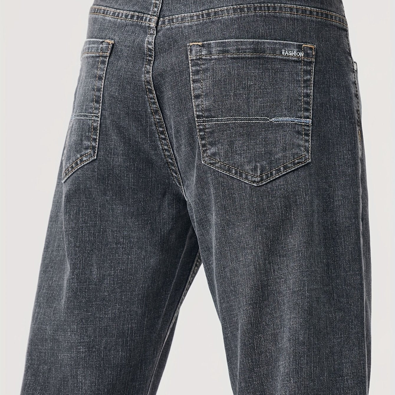 Solid loose denim trousers with pockets for men, made from breathable cotton blend. Perfect for outdoor activities.