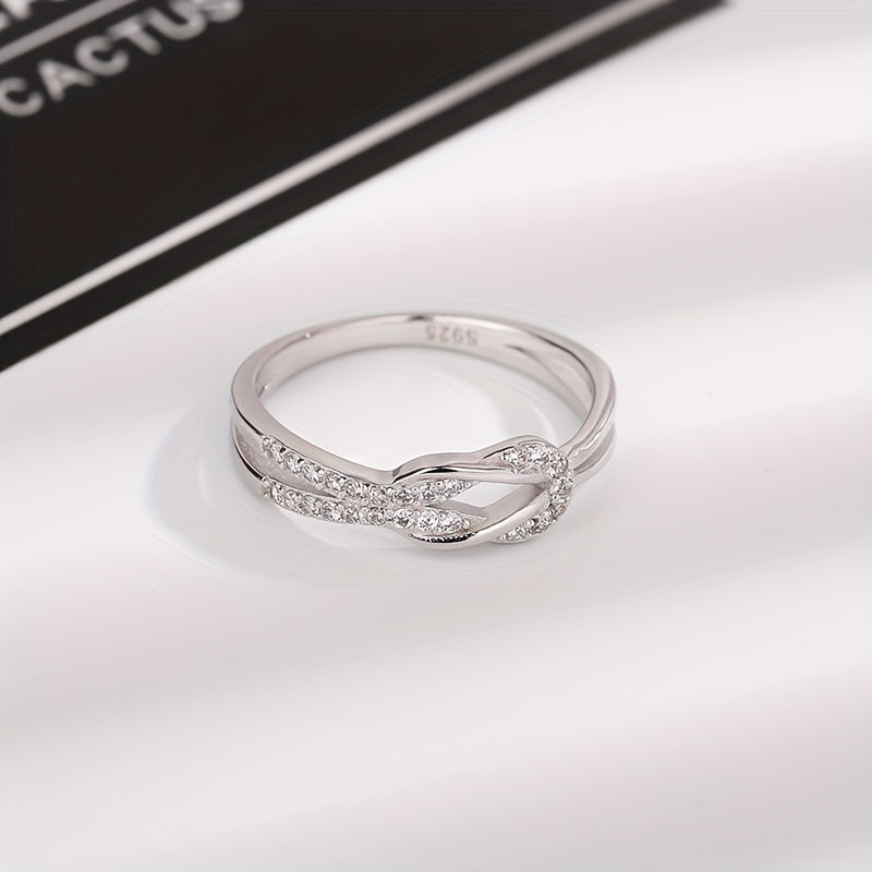 S925 sterling silver ring featuring a zirconia inlaid knot design, perfect for engagement, weddings, or as a stylish accessory for female party-goers.