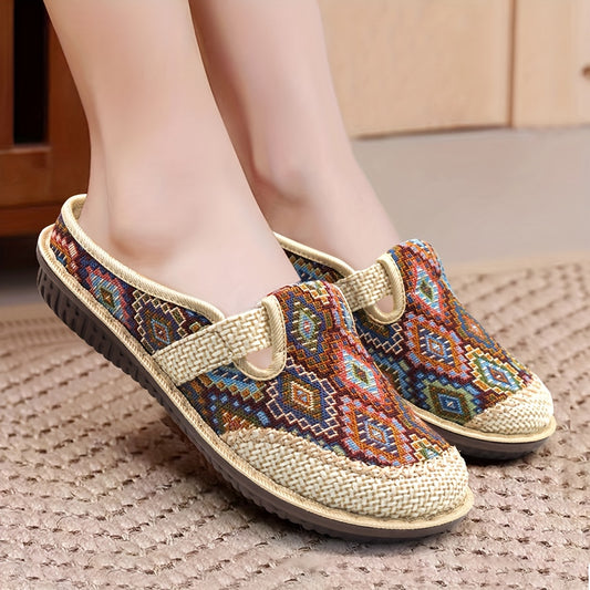 Women's printed slip-on mules with soft, lightweight soles.