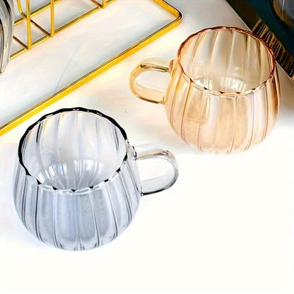 Pumpkin shaped glass cup, 350ml, insulated, hand wash only, suitable for various beverages.