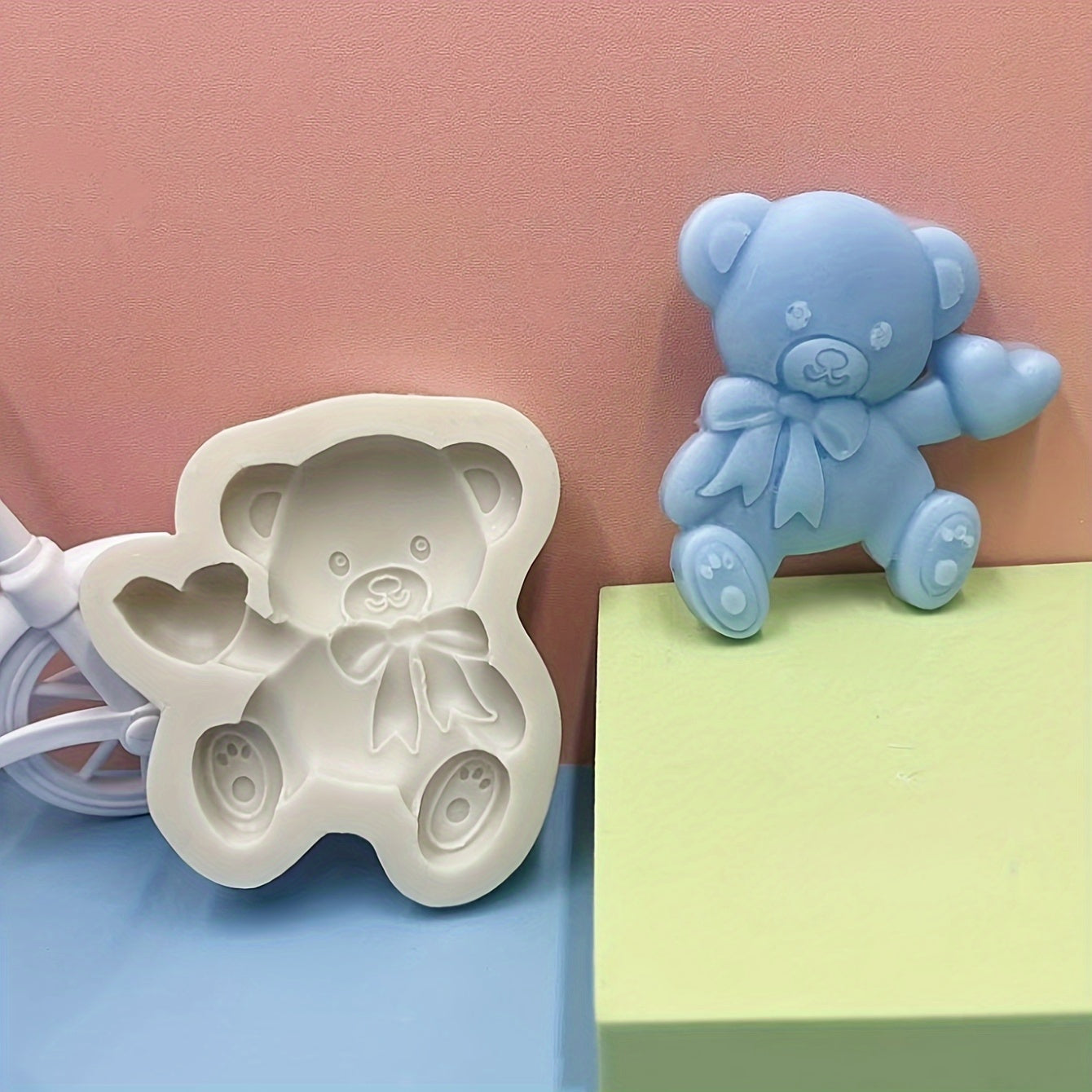 Silicone mold featuring a cute bear with a heart shape design, ideal for making mousse, fondant cakes, chocolates, and biscuits in the kitchen. This versatile tool can also be used for handmade candies, jellies, and puddings, as well as for creating drop