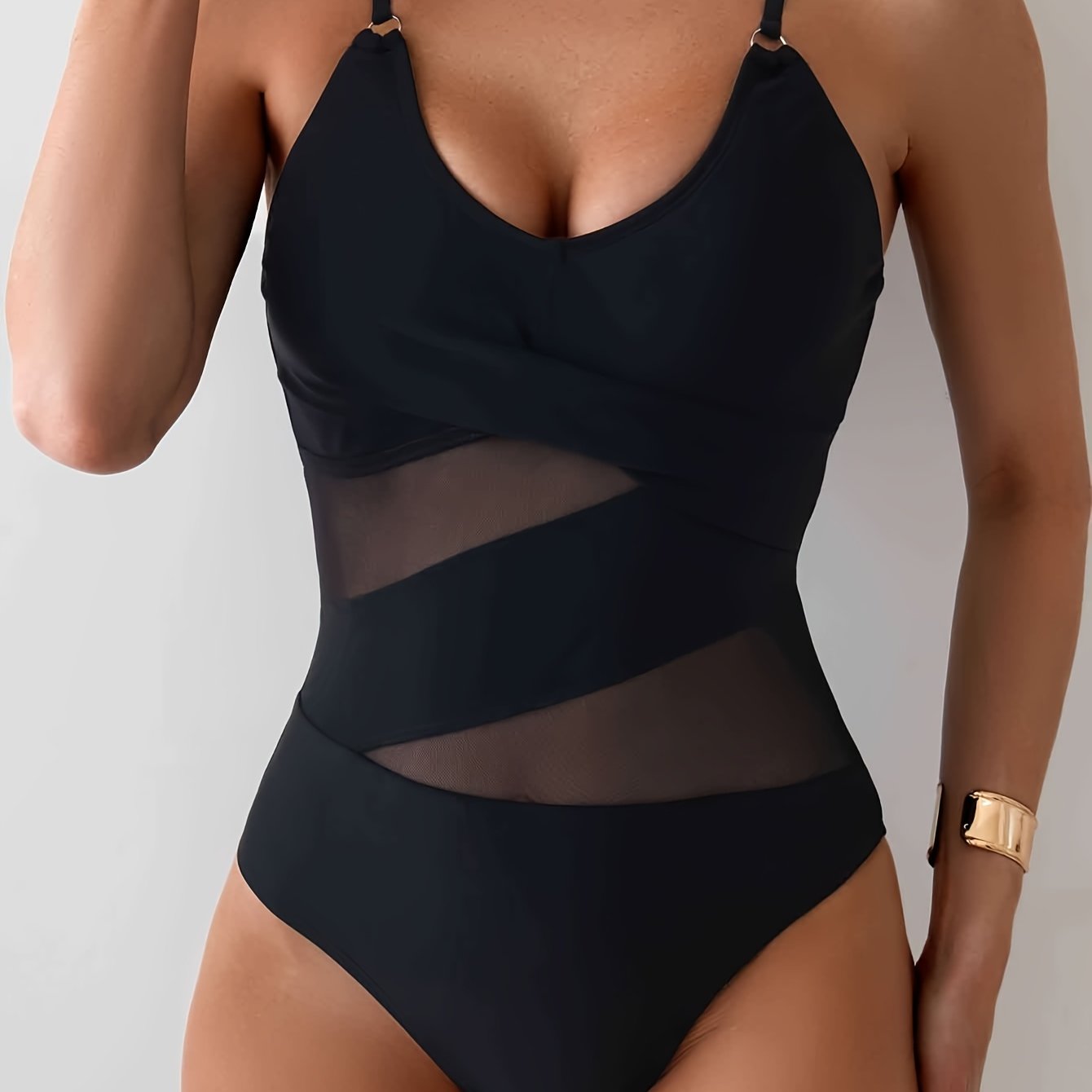 Stylish one-piece swimsuit for women with removable pads, high stretch, nylon & elastane blend, mesh detail, solid color.