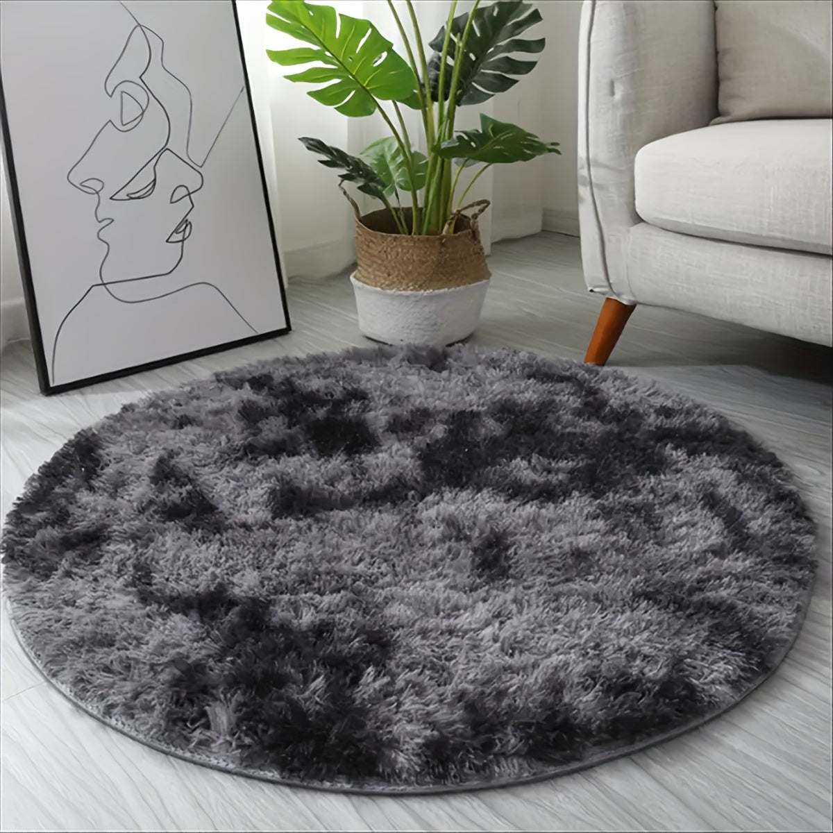 Luxuriously soft and cozy tie-dye plush rug in a deep gray hue. Crafted from easy-care, durable, thick sponge fabric perfect for the living room, bedroom, and beyond. A versatile addition to your home decor, enhancing any space with style and comfort.