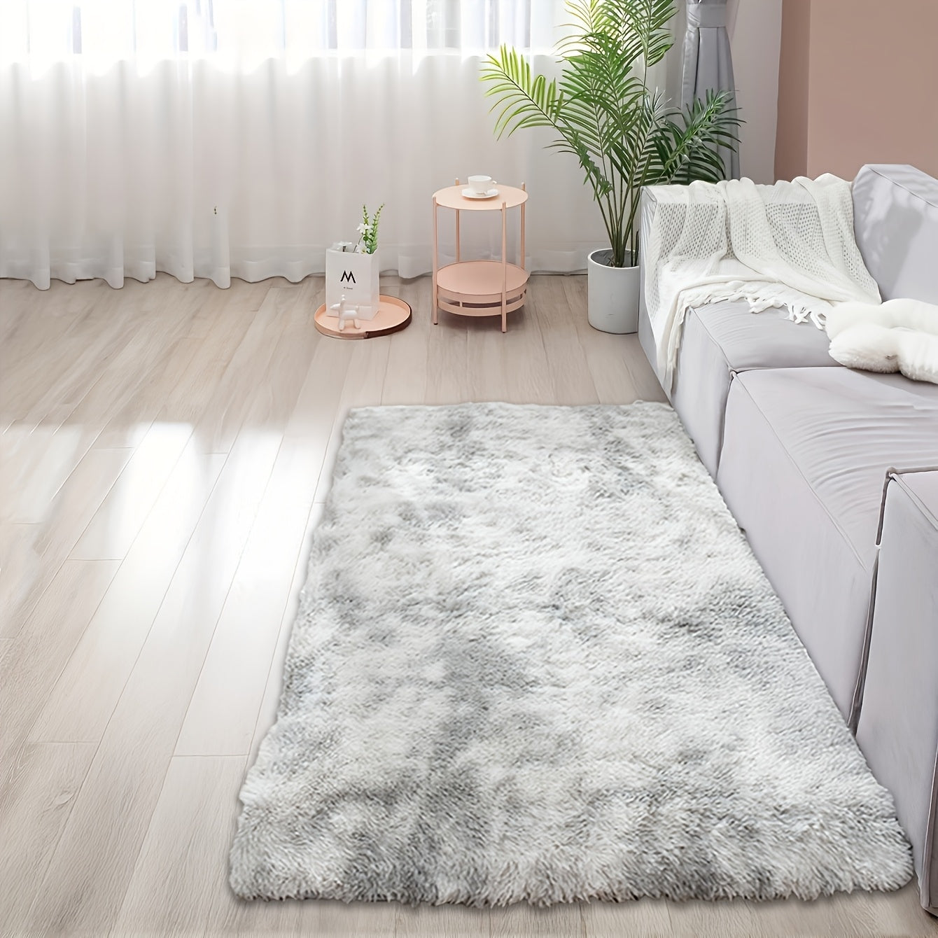 Soft and fluffy rectangle area rug perfect for your bedroom. This plush carpet is thick and non-slip, making it ideal for your living room. Made with machine-made polyester fiber, this low-pile rug is washable for easy cleaning. Perfect for indoor use.