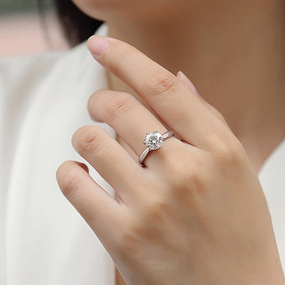 This stunning Classic Six-Prong Moissanite Promise Ring is available in 1, 2, 3, or 5 carat options. Crafted from 925 sterling silver and plated with 18k gold, this high-quality jewelry piece is perfect for engagements or marriages. It is a truly special