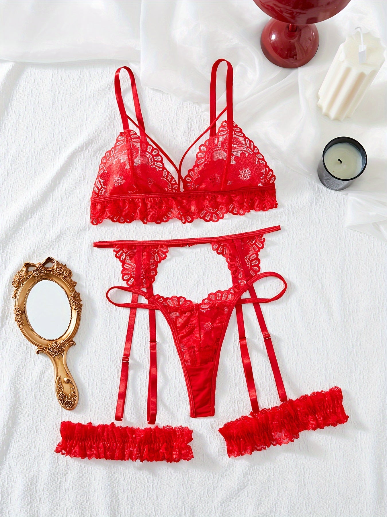 Floral lace lingerie set includes bra, thong, garter belt. Subtly sexy intimates for women.