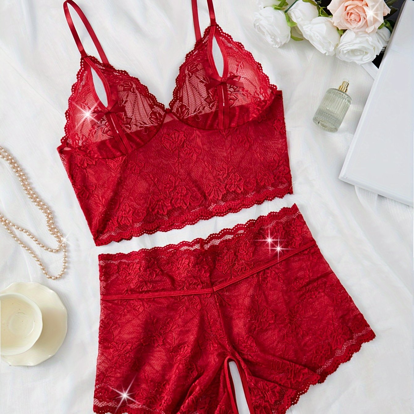 Sexy lingerie set with large size, flower lace, fan-shaped embellishment, bow front, and split bra and panty.