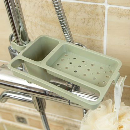 This plastic soap holder caddy with a drain is perfect for keeping your sink organized. It has open storage for sponges, cloths, and brushes, and requires no electricity. This kitchen and bathroom accessory is a must-have!