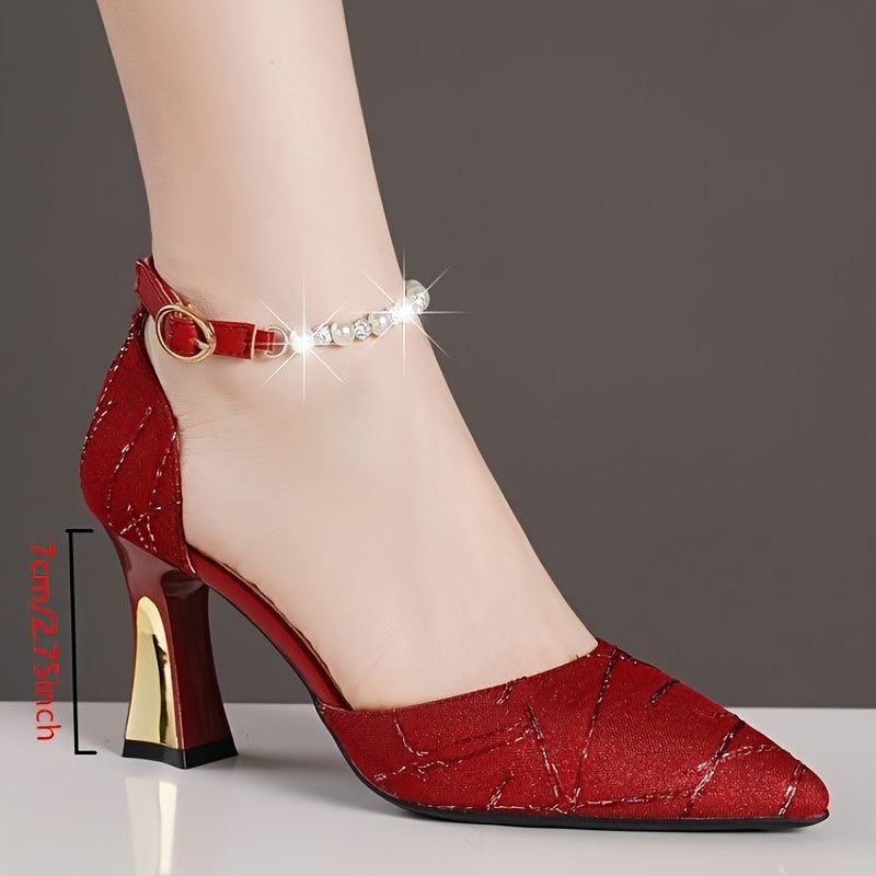 Faux pearl embellished high heels with elegant pointed toe and buckle strap.