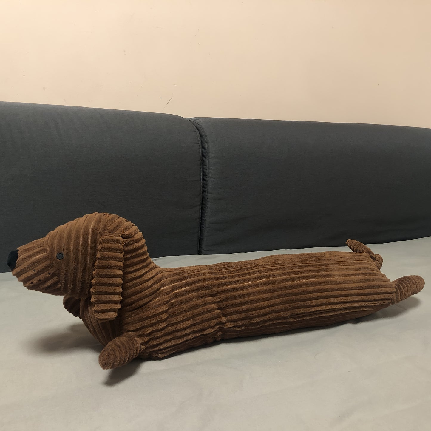 Soft, washable Dachshund dog plush pillow provides neck and waist support for lunch breaks.