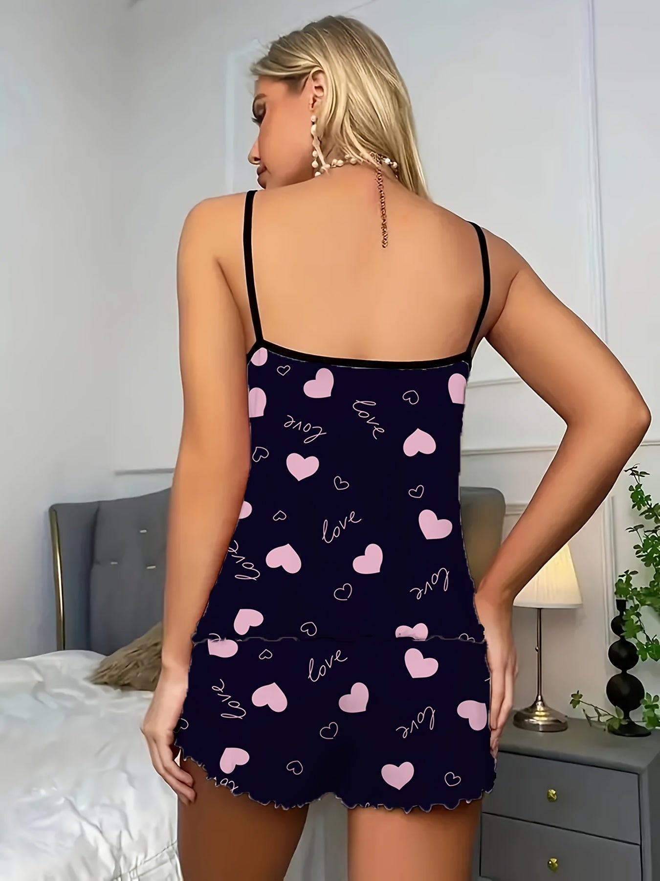 Women's sexy polyester pajama set with love heart print spaghetti strap shorts, perfect for all seasons.