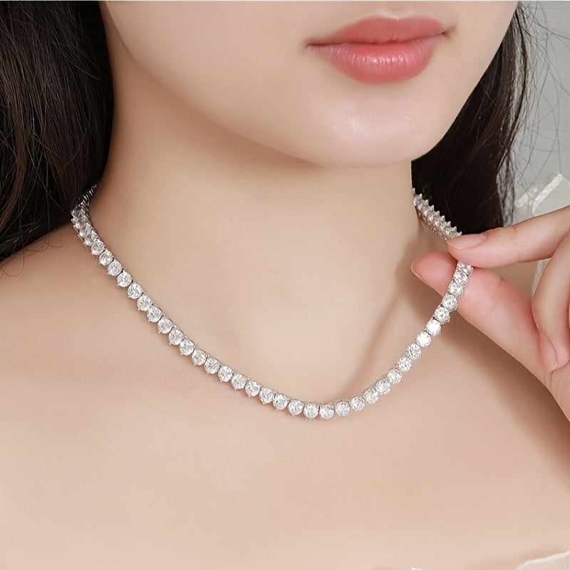 The Moissanite Tennis Necklace by Gems Lady features a 5mm stone set in S925 Sterling Silver with a unique Three-Claw Design. This elegant Clavicle Chain is perfect for all occasions including Engagement, Wedding, Anniversary, Mother's Day, Valentine's