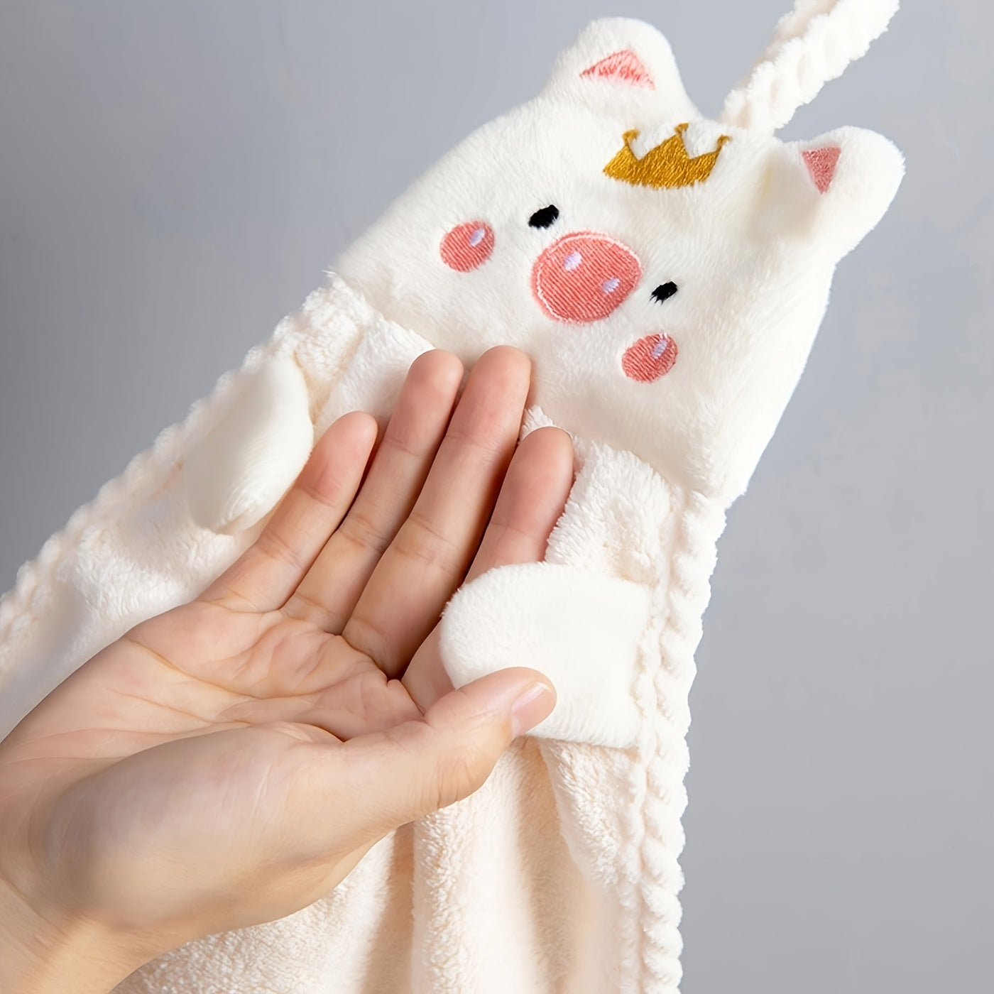 Cute pig hand towel for household use, absorbent and versatile.