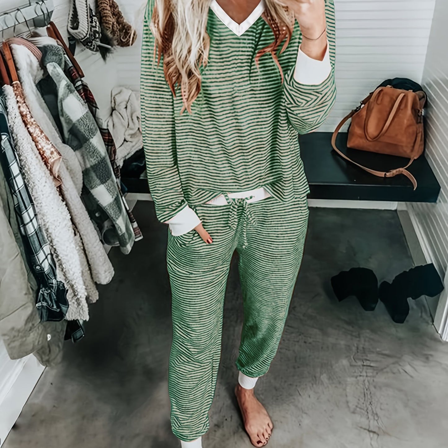 Casual knit pajama set with V-neck, striped design, and drawstring. Made of 95% polyester and 5% elastane for fall/winter home wear. Includes long sleeve top and matching lounge pants.