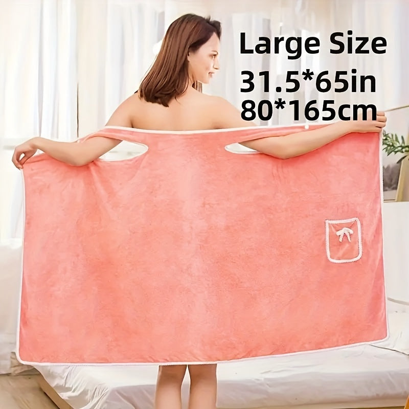 Soft coral velvet wearable bath towel with bow detail, ideal for bathroom and beach use. Thich, absorbent, quick-dry, pink with white border. Durable woven texture. Perfect for everyday comfort.