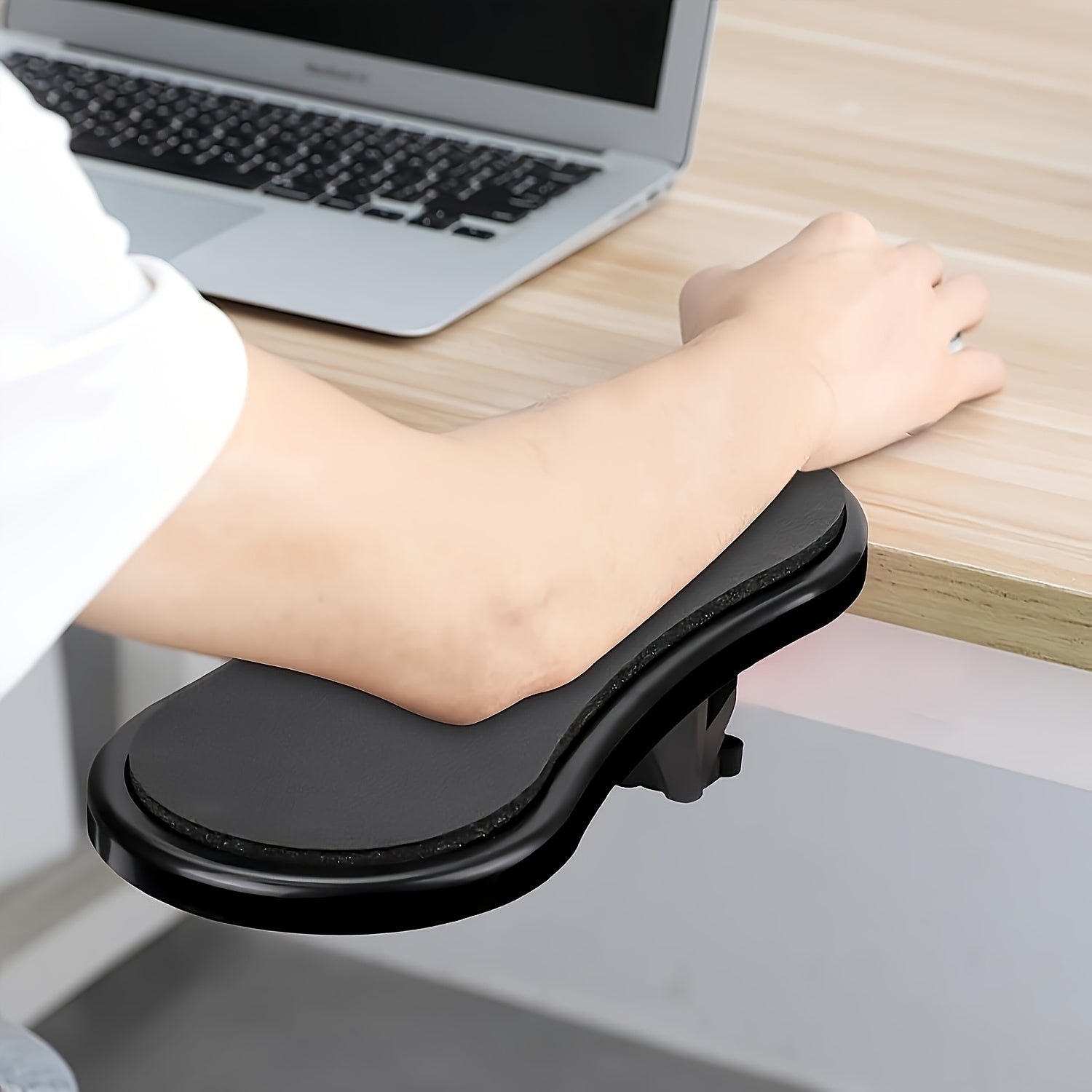 Ergonomic armrest wrist rest for computer desk, providing elbow support to reduce stress and pain during keyboard and mouse use in home office.