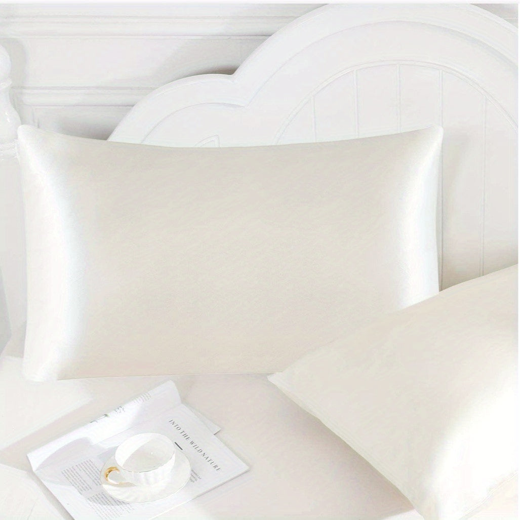 1 set of Satin Pillow Cases in a Solid Color, made with Silky Soft and Breathable material. These Pillowcases feature an Envelope Closure for a smooth and luxurious feel. Perfect for use in the Living Room, Bedroom, or Hotel, these Pillow Covers do not