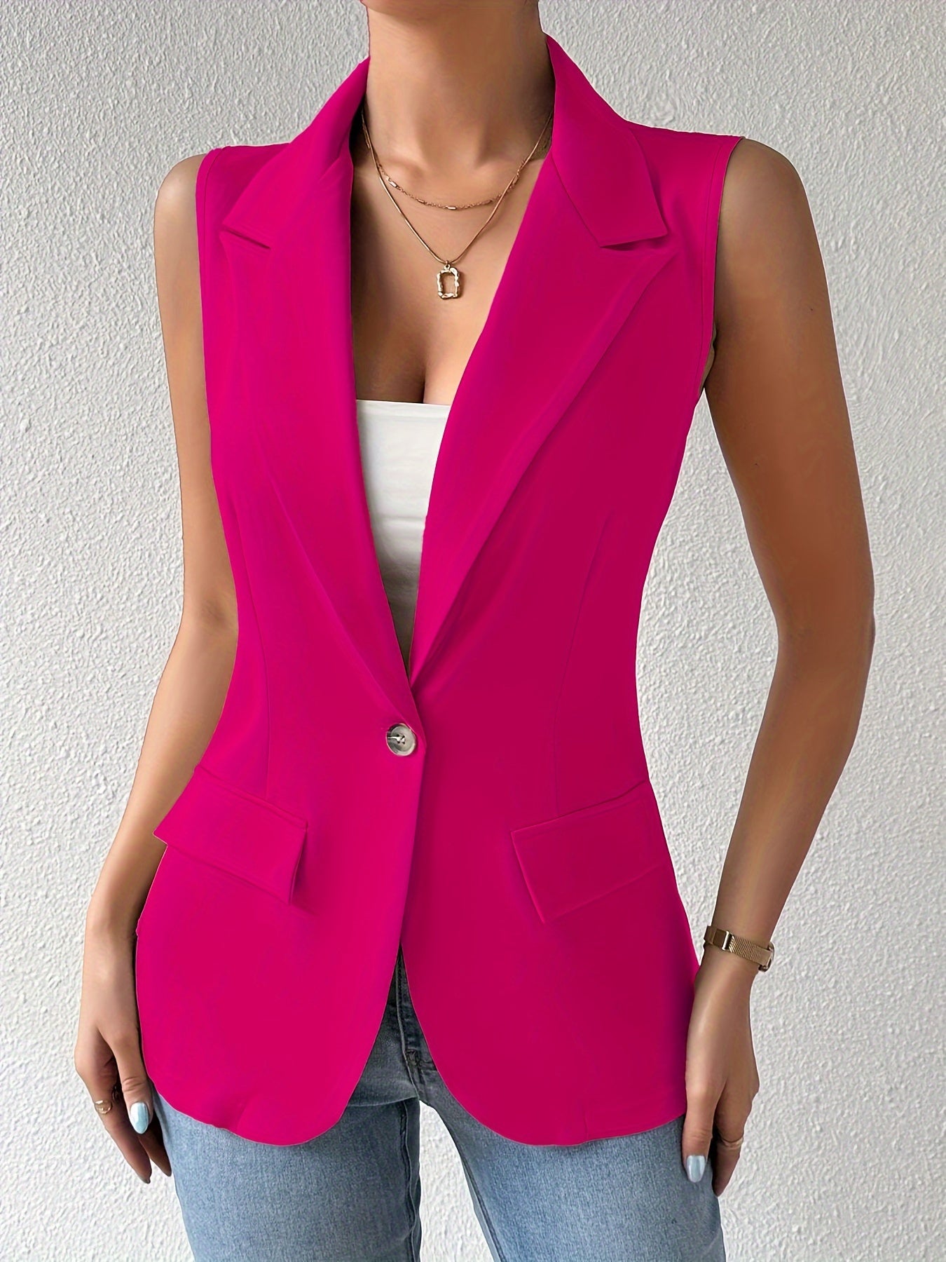 Sleeveless button front lapel vest in a solid color, suitable for spring and fall. Ideal for women's clothing.