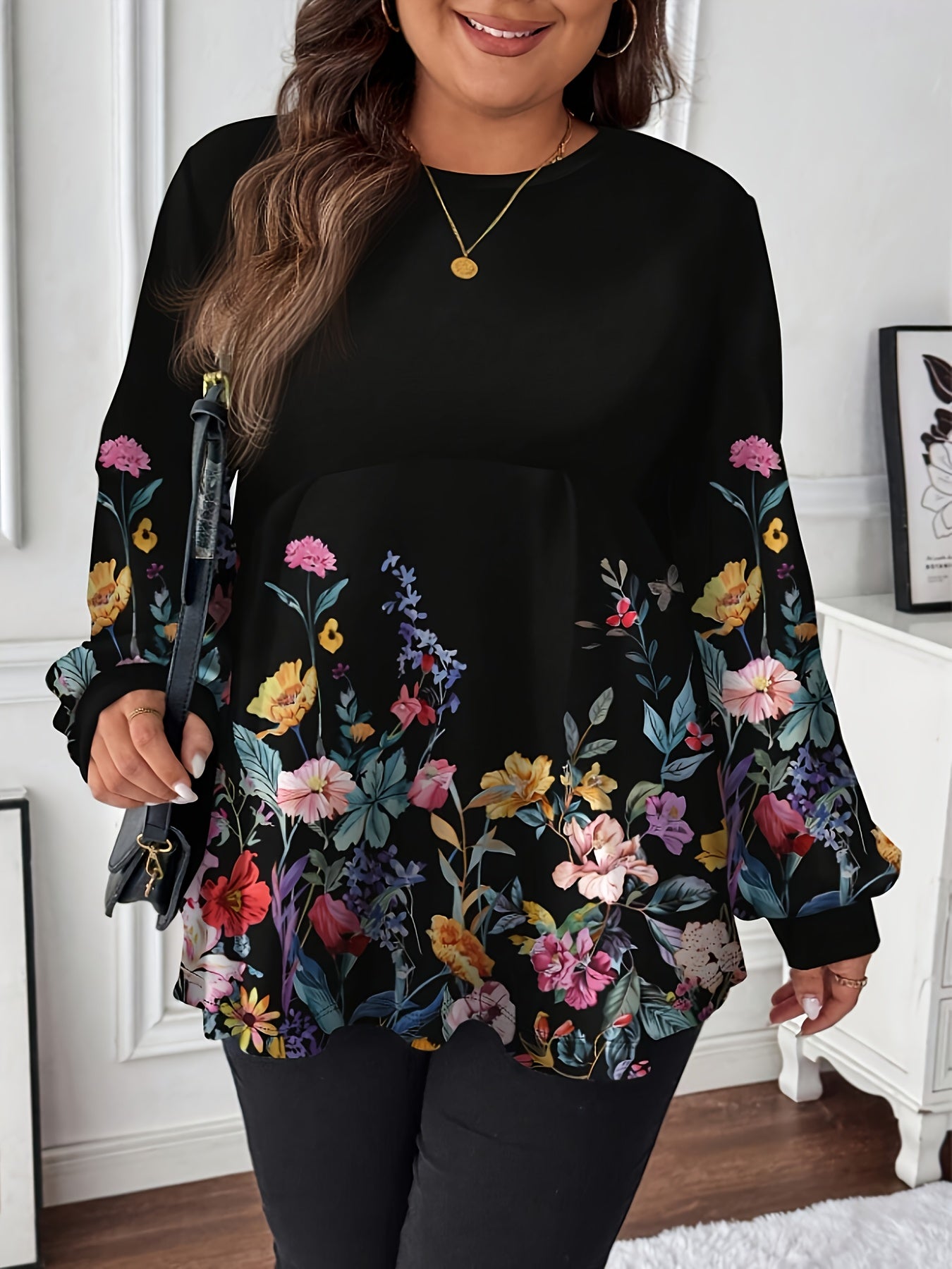 Stylish plus size floral tee with crew neck, long sleeves, draped detail, and stretchy polyester blend. Machine washable and ideal for spring and fall.