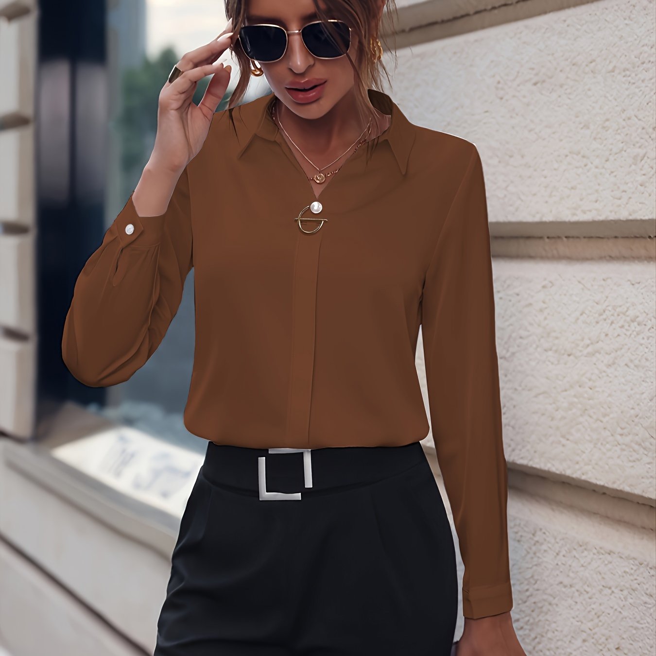 Stylish long-sleeve blouse with pearl buttons - slim fit, solid color for women, ideal for casual or office wear.