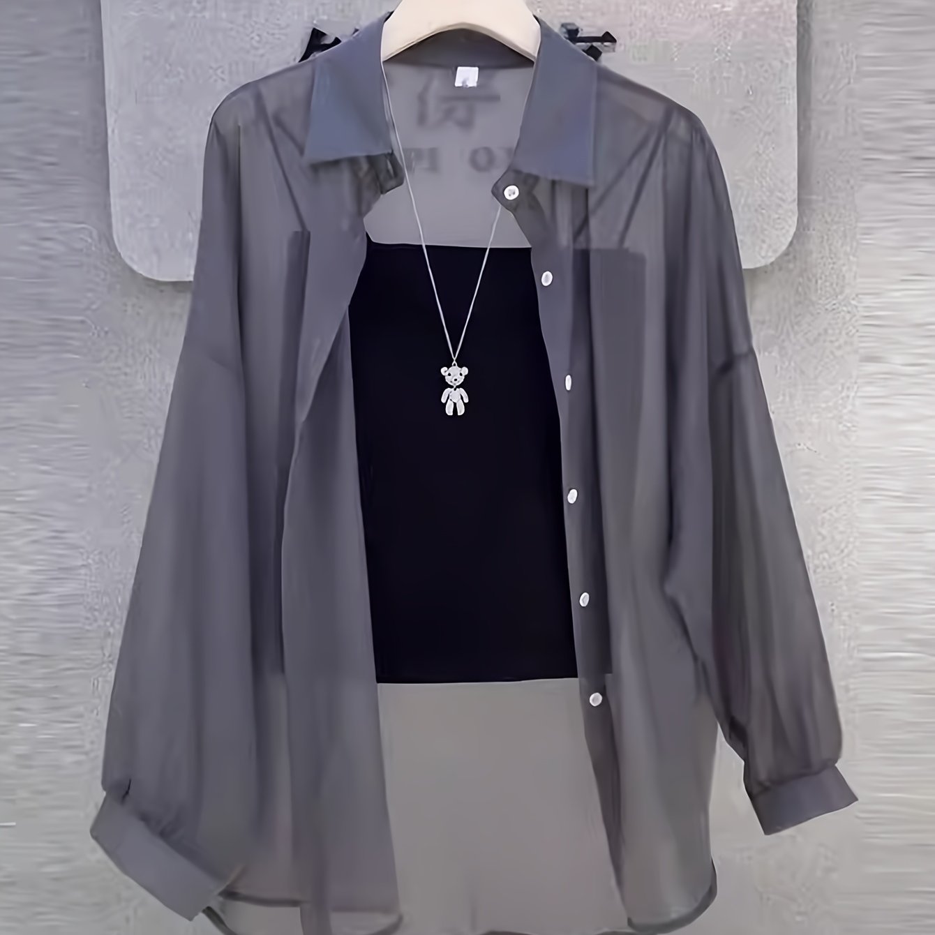 Casual women's shirt with buttons, sheer long sleeves for spring and fall.