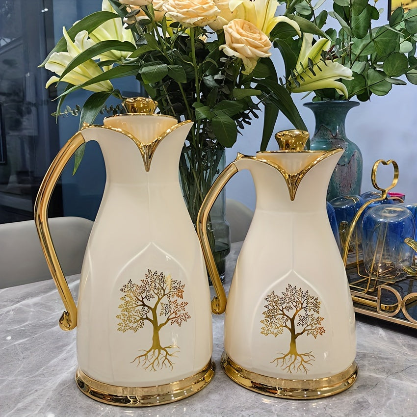 Two Vacuum Insulated Thermal Carafes for Coffee and Tea - Stainless Steel Double-Wall Flasks in 1L and 0.7L sizes, featuring an elegant Golden Tree Design. Keeps beverages hot without the need for electricity.