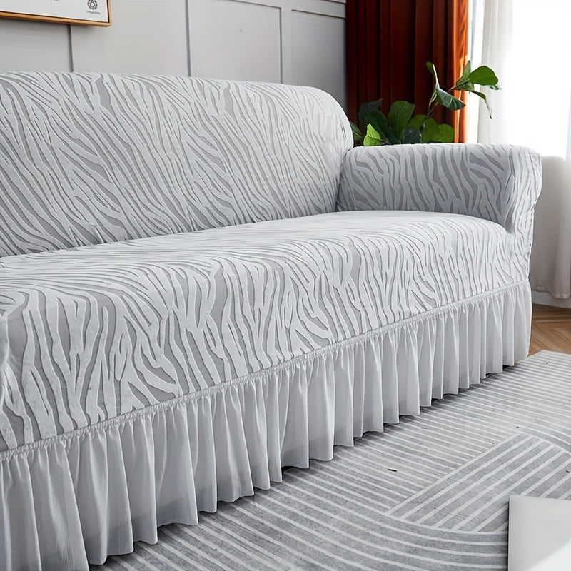 Wave pattern sofa slipcover with skirt, non-slip and dustproof. Protects furniture from cat scratches. Machine washable for easy cleaning. Suitable for bedroom, office, or living room décor.